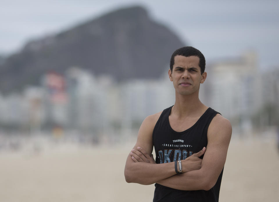 In this Oct. 16. 2018 photo, event promoter Peter Rooker poses for a portrait at Copacabana beach in Rio de Janeiro, Brazil. In the lead up to Brazil’s elections, Rooker struggled to find a presidential candidate he believed in, but he was sure of one thing though: he would not vote for far-right congressman Jair Bolsonaro or Fernando Haddad of the scandal-tainted Workers’ Party. But it was precisely these two candidates who emerged from an inconclusive first round of voting and will meet Oct. 28 in a presidential runoff. (AP Photo/Beatrice Christofaro)