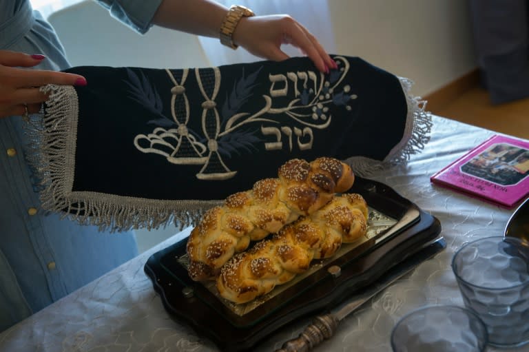 A member of the Jewish community of Porto prepares the dinner table for Shabbat festive day in Porto, on September 2, 2016