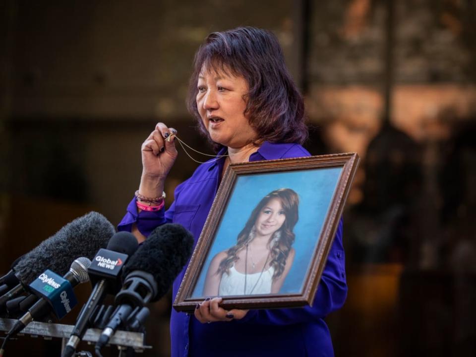 Carol Todd holds a picture of her late daughter Amanda Todd after the sentencing of Aydin Coban in New Westminster, B.C., on Friday, Oct. 14, 2022.  (Ben Nelms/CBC - image credit)