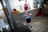 A child carries his food during lunch break at St Dunstan's College junior school as some schools re-open following the outbreak of the coronavirus disease (COVID-19) in London