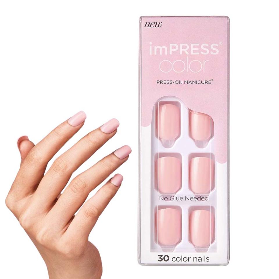 hand wearing pink press-on nails; pink press-on nail kit