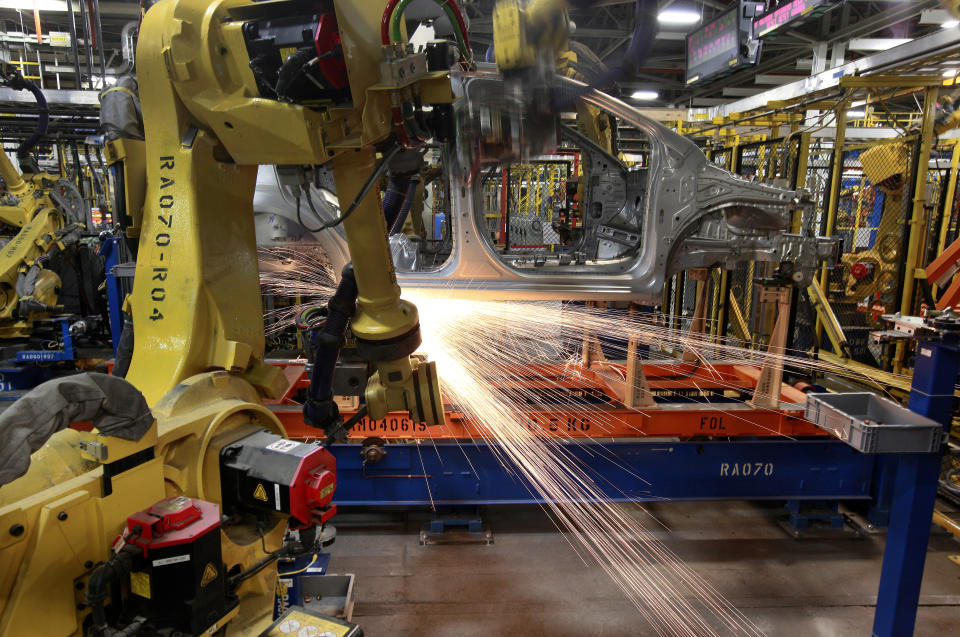 In this May 19, 2011 photo, robots weld a Chevrolet Sonic at the General Motors Orion Assembly plant in Orion Township, Mich. General Motors, Ford, jet engine maker Rolls-Royce and other companies are talking to their governments about repurposing idled factories to produce vital goods to fight the coronavirus such as ventilators and surgical masks. On Friday, March 20, 2020 President Donald Trump invoked the Korean War-era Defense Production Act, allowing the government to marshal the private sector to fight the COVID-19 pandemic. Although it allows the government to steer factories to overcome shortages, makers of heavy goods such as cars and trucks can't just flip a switch and produce something else. (AP Photo/Paul Sancya)