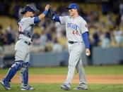 Oct 19, 2016; Los Angeles, CA, USA; Chicago Cubs first baseman Anthony Rizzo (44) celebrates with catcher Willson Contreras (40) after game four of the 2016 NLCS playoff baseball series against the Los Angeles Dodgers at Dodger Stadium. Mandatory Credit: Gary A. Vasquez-USA TODAY Sports