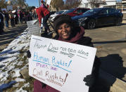 <p>Gladys Bunzy, of Jackson, Miss., protests Saturday, Dec. 9, 2017, against the visit of President Donald Trump in Jackson, Miss. (Photo: Jeff Amy/AP) </p>