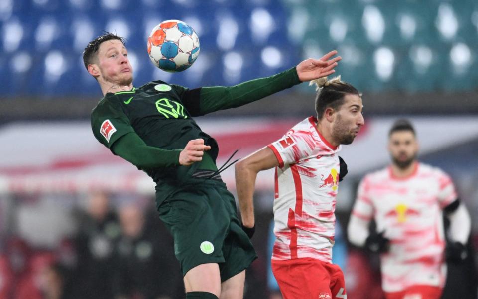 Wolfsburg's Wout Weghorst in action with RB Leipzig's Willi Orban - Reuters