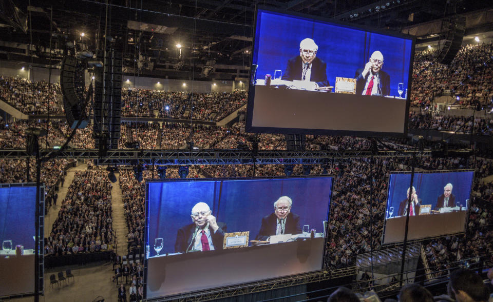 Berkshire Hathaway Chairman and CEO Warren Buffett and his Vice Chairman Charlie Munger, in red tie, are seen on large screens, as they preside over the Berkshire Hathaway shareholders meeting in Omaha, Neb., Saturday, May 6, 2017. More than 30,000 people were expected to attend the annual Berkshire Hathaway shareholders meeting. (AP Photo/Nati Harnik)