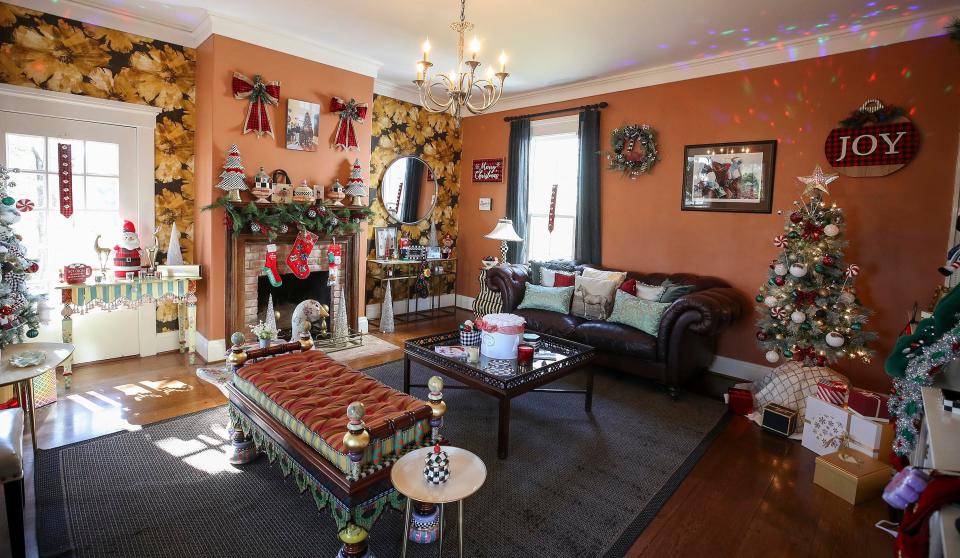 The front room at Chestnut Hall, a historic farmhouse in Kentucky, is full of Christmas decor.