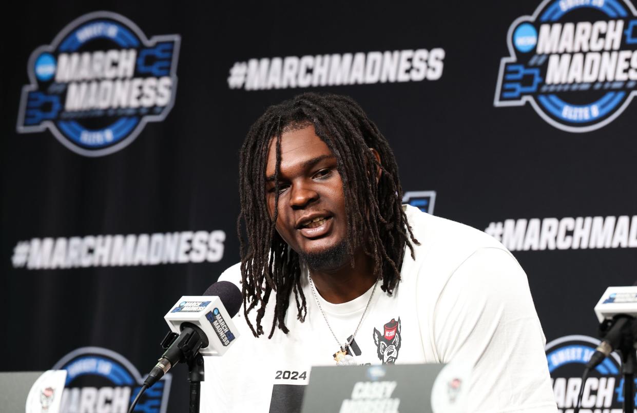 North Carolina State forward DJ Burns Jr. (30) speaks to the media during a practice day at American Airlines Center.