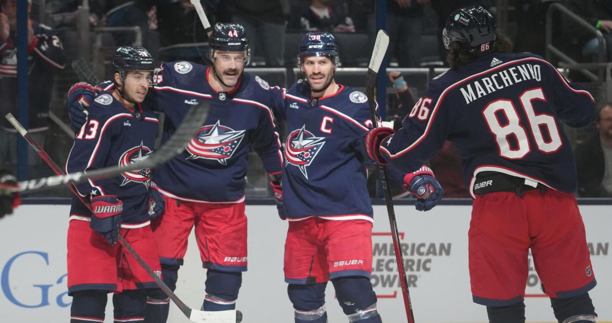 Nov 22, 2023; Columbus, Ohio, USA; Columbus Blue Jackets left wing Johnny Gaudreau (13), Columbus Blue Jackets defenseman Erik Gudbranson (44, Columbus Blue Jackets center Boone Jenner (38) celebrate with Columbus Blue Jackets left wing Kirill Marchenko (86) during the first period of the NHL hockey game at Nationwide Arena in Columbus on November 22, 2023.