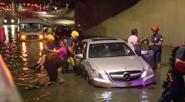 PHOTO: Rescue crews help people in cars stuck in flooded roads in the Las Vegas area, July 28, 2022, after heavy rains caused flash floods. (KTNV)