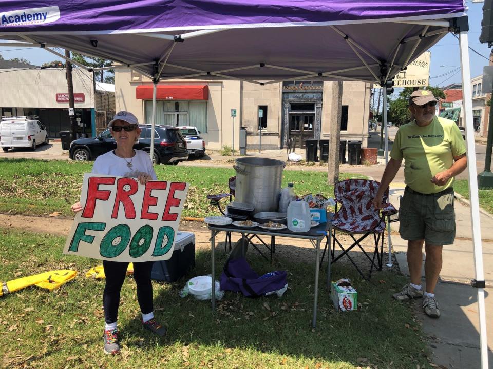 Joyce and Dave Thomas offer free jambalaya, cooked up by one of their neighbors in New Orleans after Hurricane Ida hit and left much of the city without power.