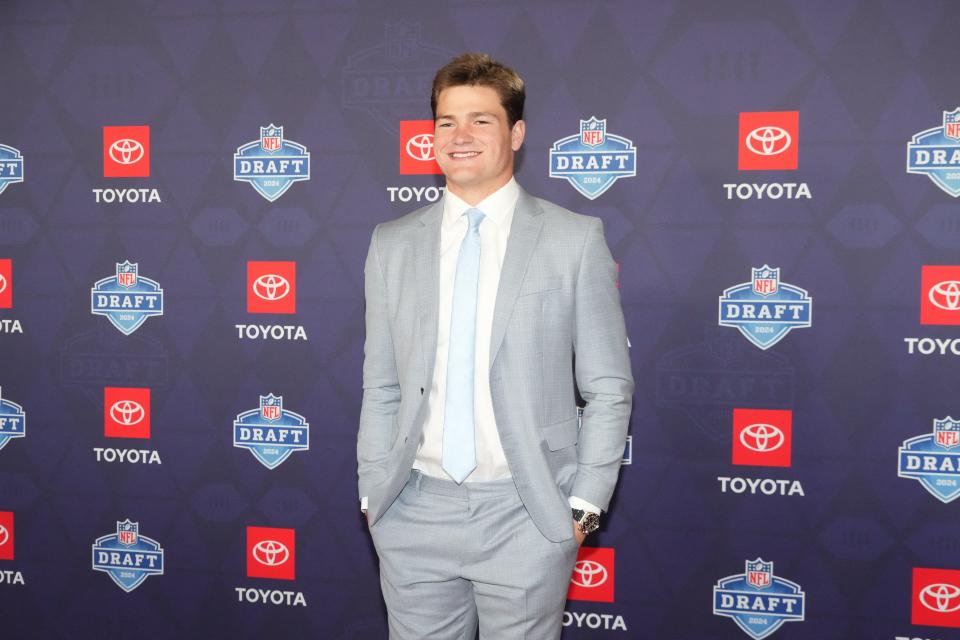 North Carolina quarterback Drake Maye stands on the red carpet ahead of the 2024 NFL Draft at Detroit’s Fox Theatre on Thursday. He was selected by the New England Patriots at No. 3.