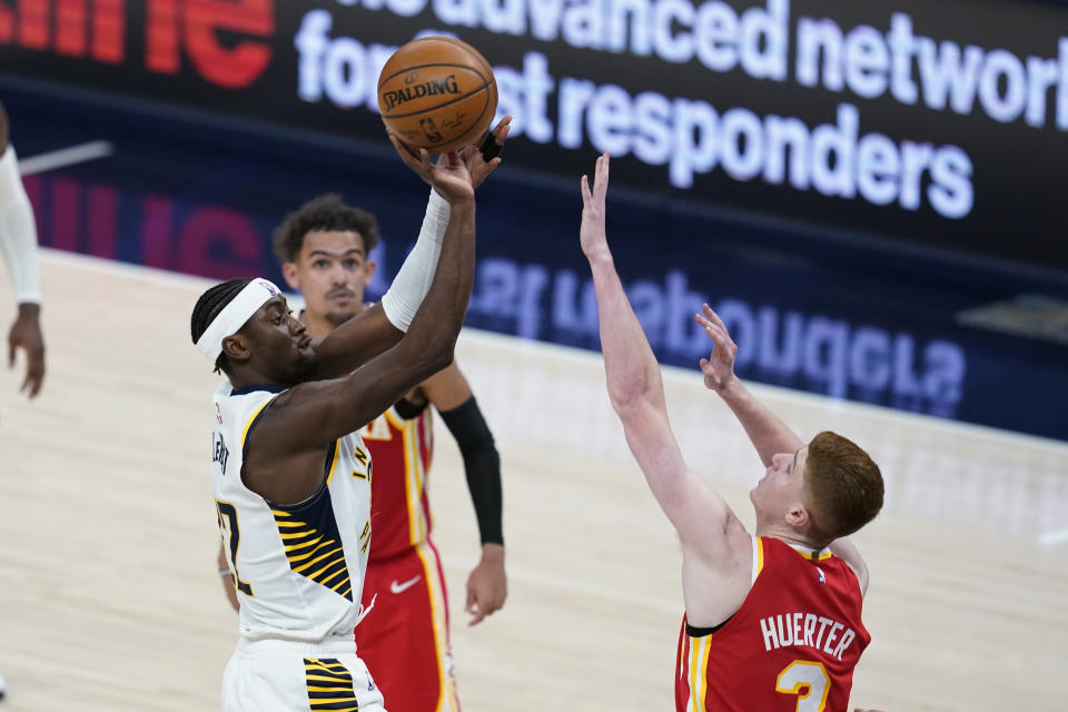 Indiana Pacers' Caris LeVert (22) shoots over Atlanta Hawks' Kevin Huerter (3) during the second half of an NBA basketball game Thursday, May 6, 2021, in Indianapolis. (AP Photo/Darron Cummings)