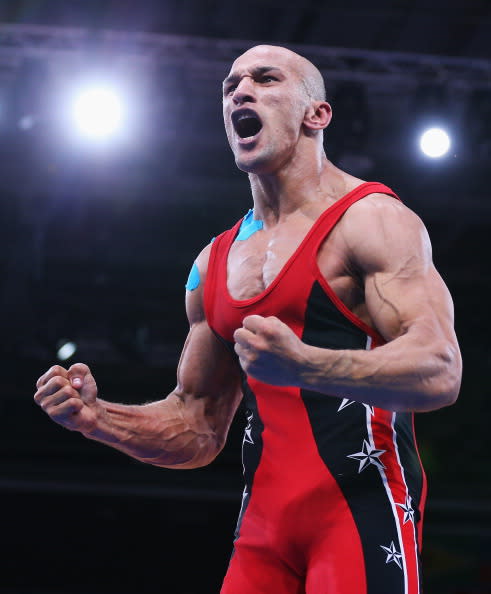 LONDON, ENGLAND - AUGUST 06: Karam Mohamed Gaber Ebrahim of Egypt celebrates winning his Men's Greco-Roman 84 kg Wrestling Semi Final against Damian Janikowski of Poland on Day 10 of the London 2012 Olympic Games at ExCeL on August 6, 2012 in London, England. (Photo by Cameron Spencer/Getty Images)