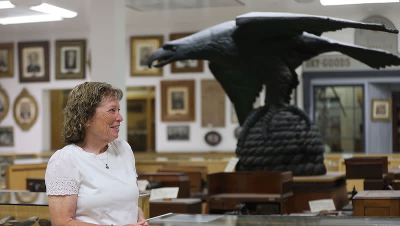 Ellen Jeppson, Pioneer Memorial Museum president, talks about the original eagle gate sculpture exhibited at the museum in Salt Lake City on Friday, July 14, 2023.