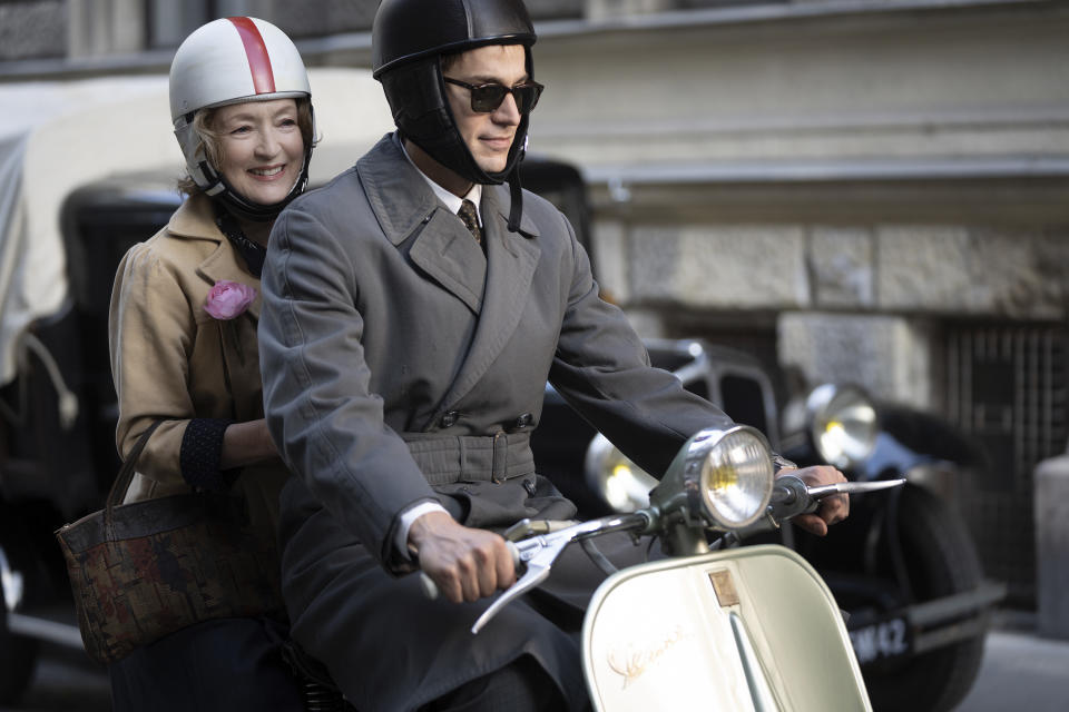 This image released by Focus Features shows Lesley Manville, left, and Lucas Bravo in a scene from "Mrs. Harris Goes to Paris." (Liam Daniel/Focus Features via AP)