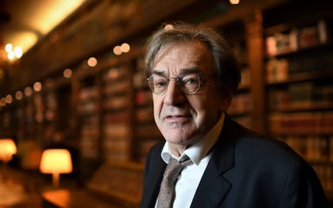 Alain Finkielkraut poses in the French Academy's library - Credit: ERIC FEFERBERG/AFP