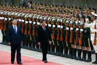 Philippine President Rodrigo Duterte (C) inspected a guard of honour at the Great Hall of the People in Beijing, on October 20, 2016