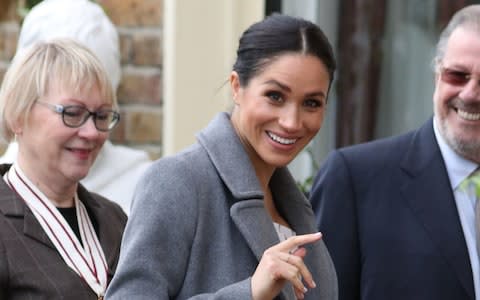 Meghan Markle was all smiles as she met the retired actors  - Credit: Andrew Matthews/PA Wire