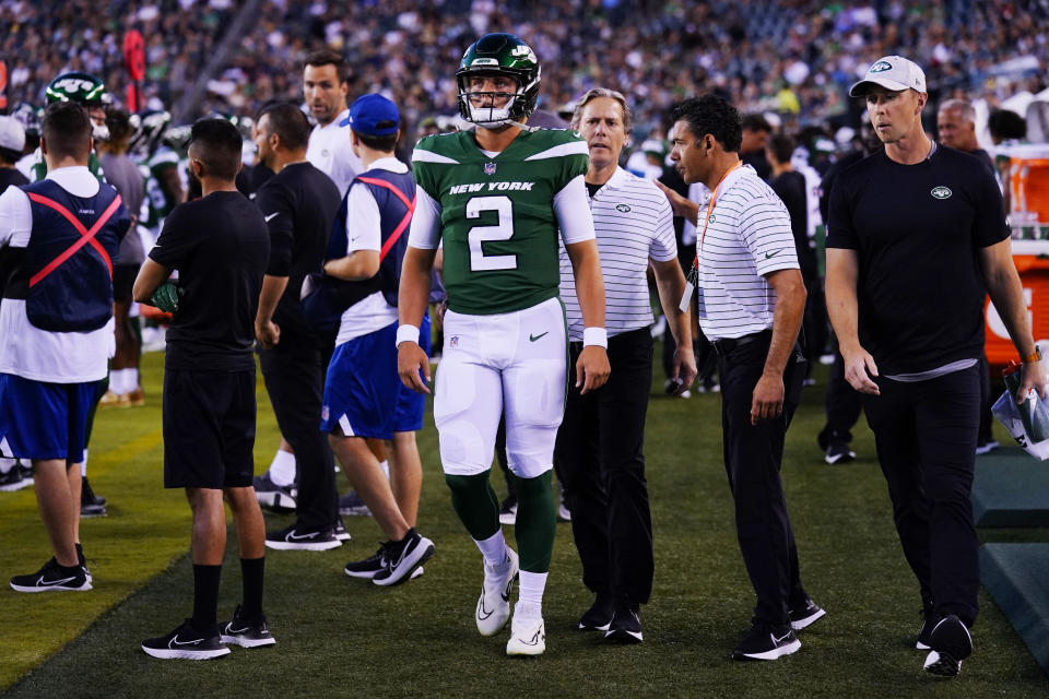 New York Jets' Zach Wilson walks on the sidelines after he is taken off the field following an injury during the first half of a preseason NFL football game against the Philadelphia Eagles on Friday, Aug. 12, 2022, in Philadelphia. (AP Photo/Matt Rourke)