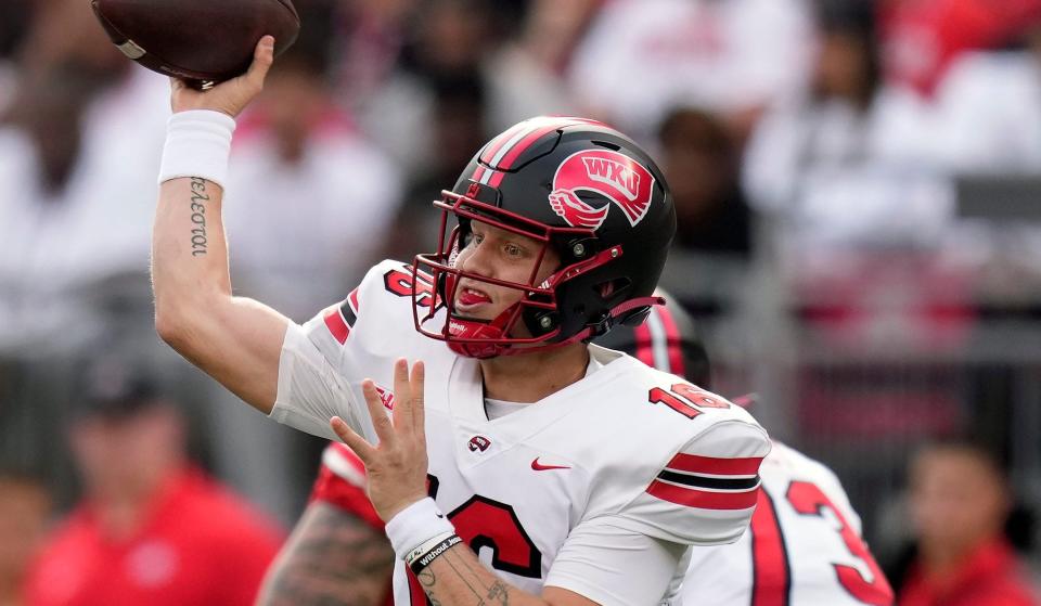 Sep 16, 2023; Columbus, Ohio, USA; Western Kentucky Hilltoppers quarterback Austin Reed (16) throws the ball against Ohio State Buckeyes during the first quarter of their game at Ohio Stadium.