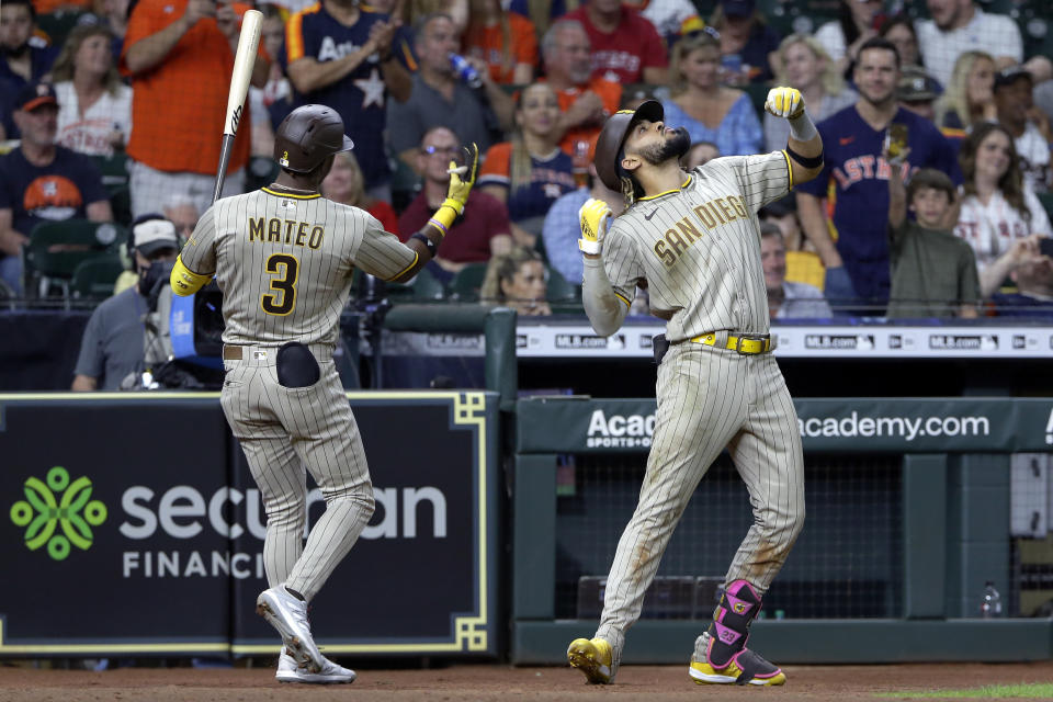 San Diego Padres' Jorge Mateo (3) and Fernando Tatis Jr., right, celebrate Tatis' home run during the seventh inning of the team's baseball game against the Houston Astros Friday, May 28, 2021, in Houston. (AP Photo/Michael Wyke)