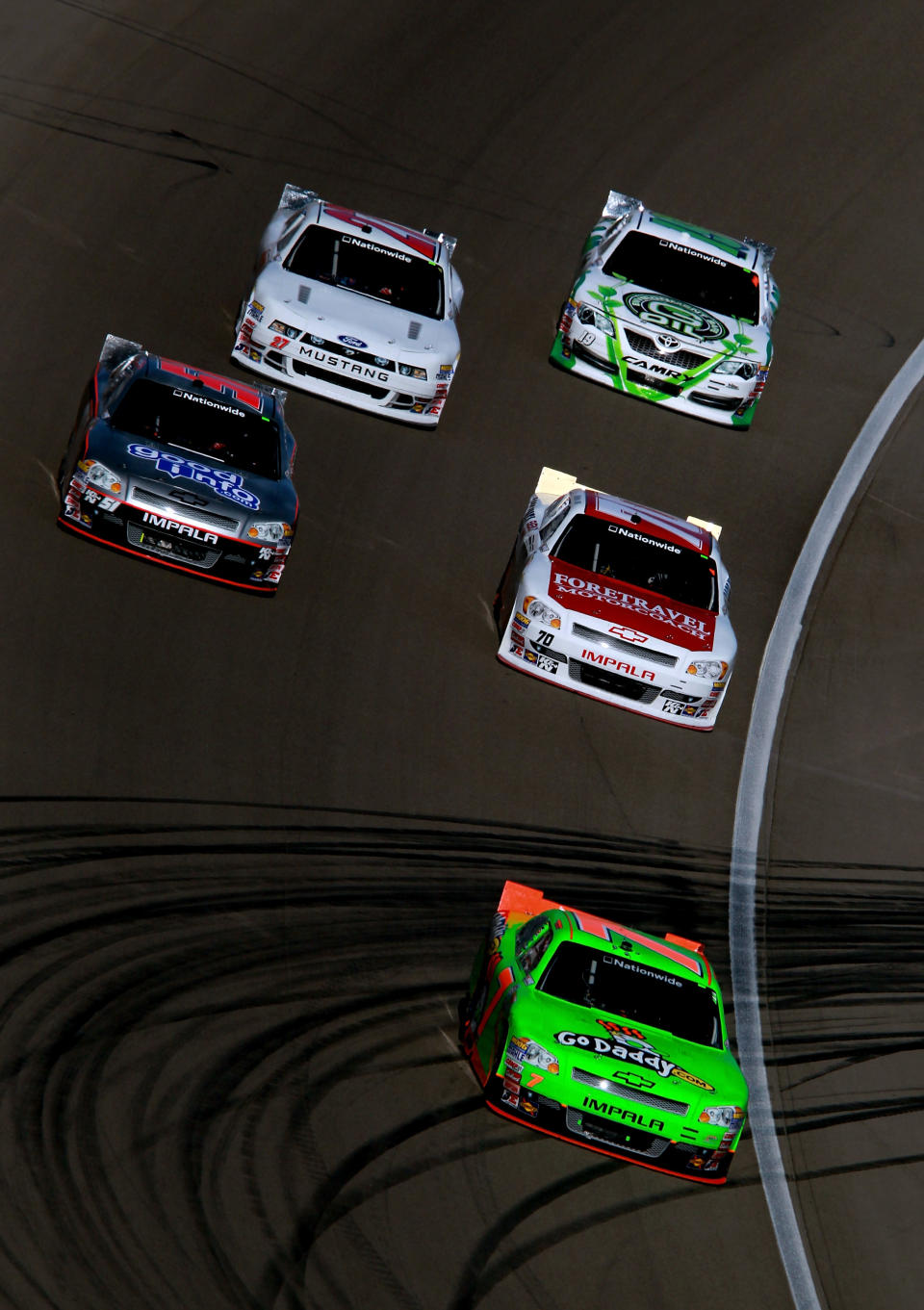 LAS VEGAS, NV - MARCH 10: Danica Patrick, driver of the #7 GoDaddy.com Chevrolet, leads a pack of cars during the NASCAR Nationwide Series Sam's Town 300 at Las Vegas Motor Speedway on March 10, 2012 in Las Vegas, Nevada. (Photo by Ronald Martinez/Getty Images for NASCAR)