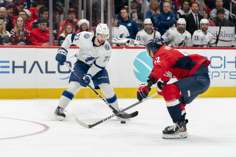 Tampa Bay Lightning center Anthony Cirelli (71) advances toward the net as Washington Capitals defenseman Martin Fehervary (42) defends during the second period of an NHL hockey game Saturday, Dec. 23, 2023, in Washington. (AP Photo/Stephanie Scarbrough)