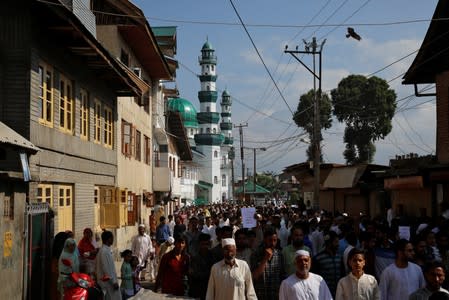 Kashmiris attend a protest after Eid-al-Adha prayers at a mosque during restrictions after the scrapping of the special constitutional status for Kashmir by the Indian government, in Srinagar