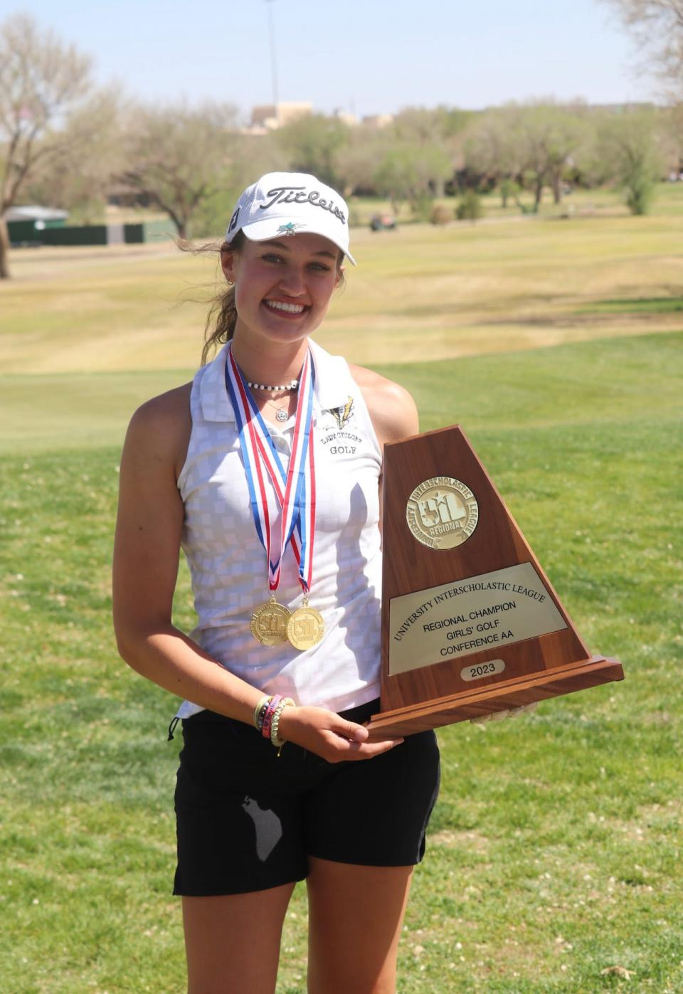 Memphis' Maggie Cook poses with the regional championship trophy in 2023.