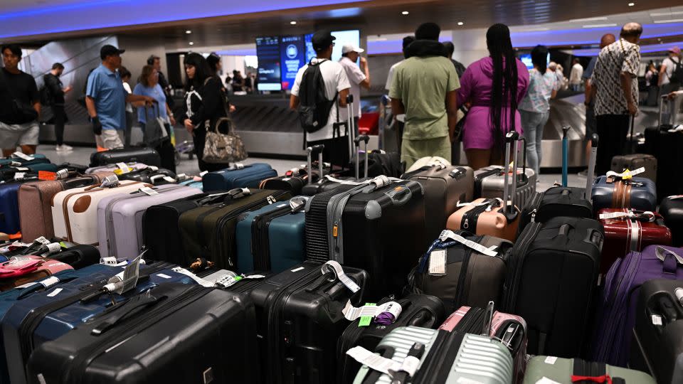 Bags await reunification with their owners in the Delta Air Lines baggage claim area Los Angeles International Airport on July 24 - Patrick T. Fallon/AFP/Getty Images