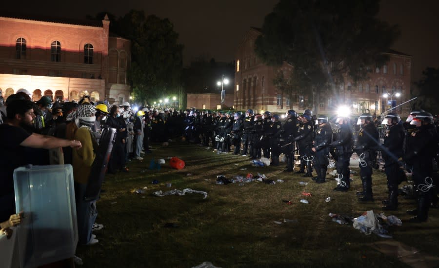 LOS ANGELES, CALIFORNIA – May 2: Police officers push pro-Palestinian protesters backwards after an oder to disperse was given at UCLA early Thursday morning. (Wally Skalij/Los Angeles Times via Getty Images)