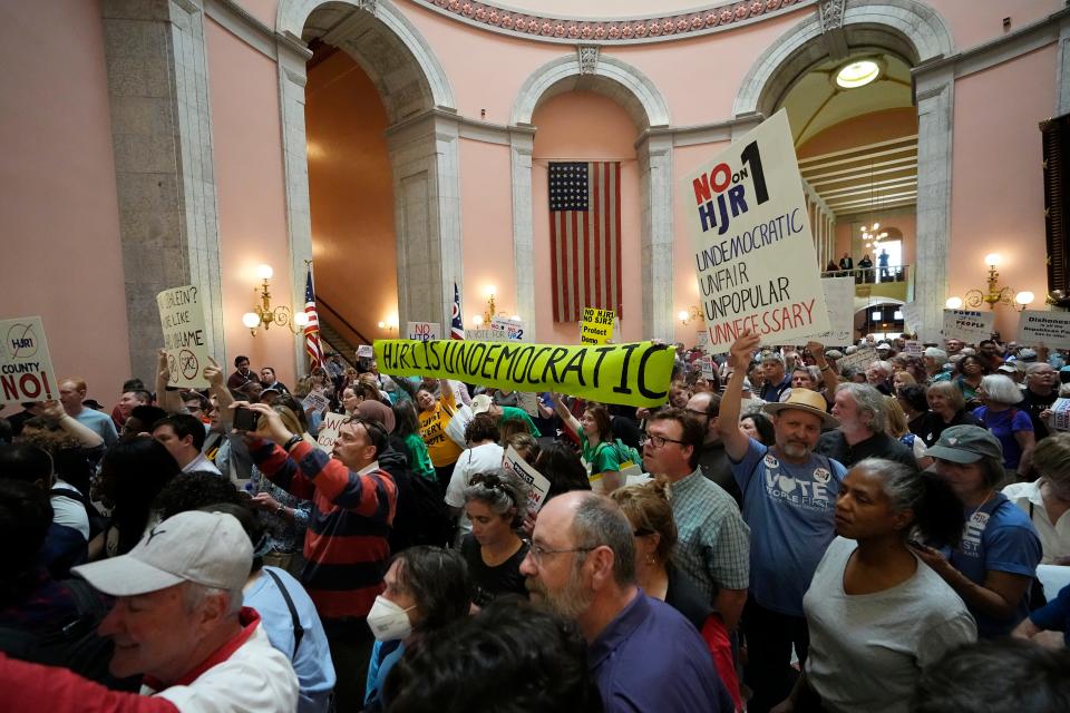 Protesters for and against SJR 2 convene inside the Ohio Statehouse before the House vote on Wednesday.