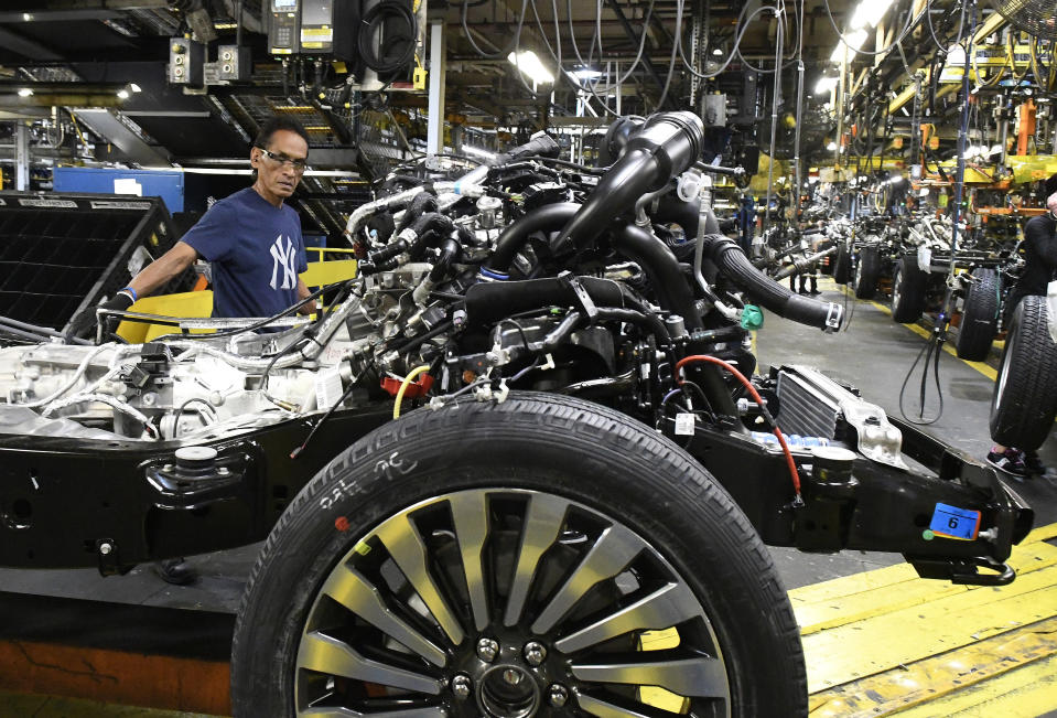 FILE – In this Oct. 27, 2017 file photo, workers assemble Ford trucks at the Ford Kentucky Truck Plant in Louisville, Ky. (AP Photo/Timothy D. Easley, File)