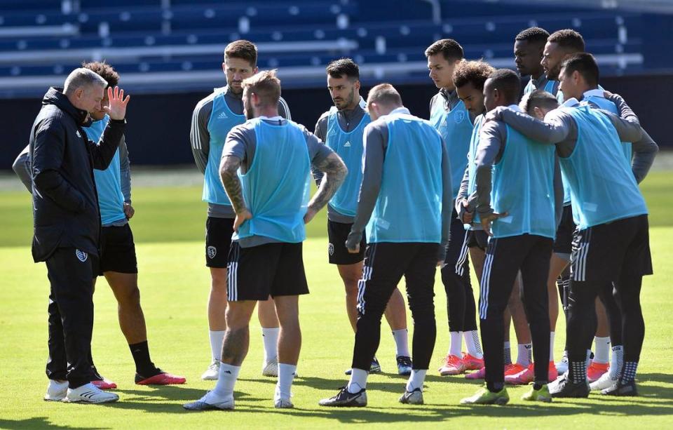 Sporting Kansas City coach Peter Vermes, left, talked to a group of players that included Daniel Salloi during a preseason workout at Children’s Mercy Park in Kansas City, Kan.
