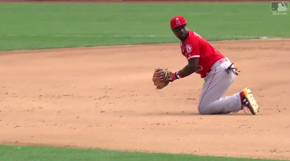 Brandon Phillips prepares to flip the ball behind his back to start a double play. (MLB.com)