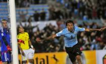 Uruguay's Abel Hernandez (R) reacts after scoring as Colombia's goalkeeper David Ospina looks on during their 2018 World Cup qualifying soccer match at the Centenario stadium in Montevideo, Uruguay, October 13, 2015. REUTERS/Carlos Pazos