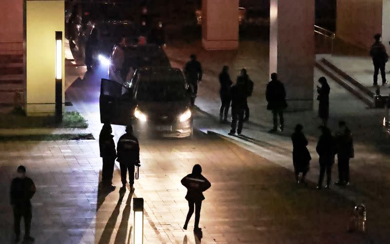 Members of the World Health Organization (WHO) team tasked with investigating the origins of the coronavirus disease (COVID-19) leave the Wuhan Center for Disease Control and Prevention in Wuhan