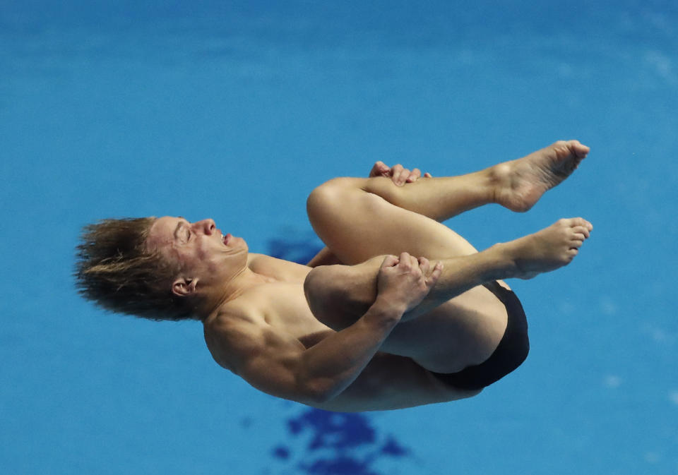 Australia's Cassiel Rousseau performs in the mixed team event diving final at the World Swimming Championships in Gwangju, South Korea, Tuesday, July 16, 2019. (AP Photo/Lee Jin-man )