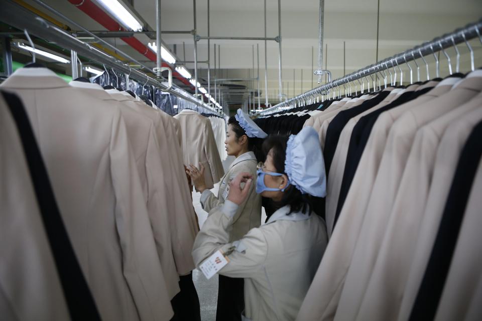 North Korean employees check finished products in a factory of a South Korean company at the Joint Industrial Park in Kaesong industrial zone