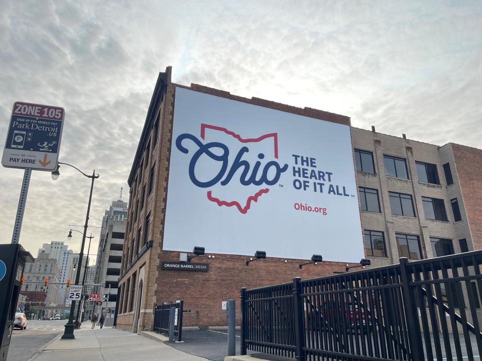 An Ohio tourism sign on a building at Fort Street and Second Avenue in downtown Detroit, on Tuesday, May 23, 2023.