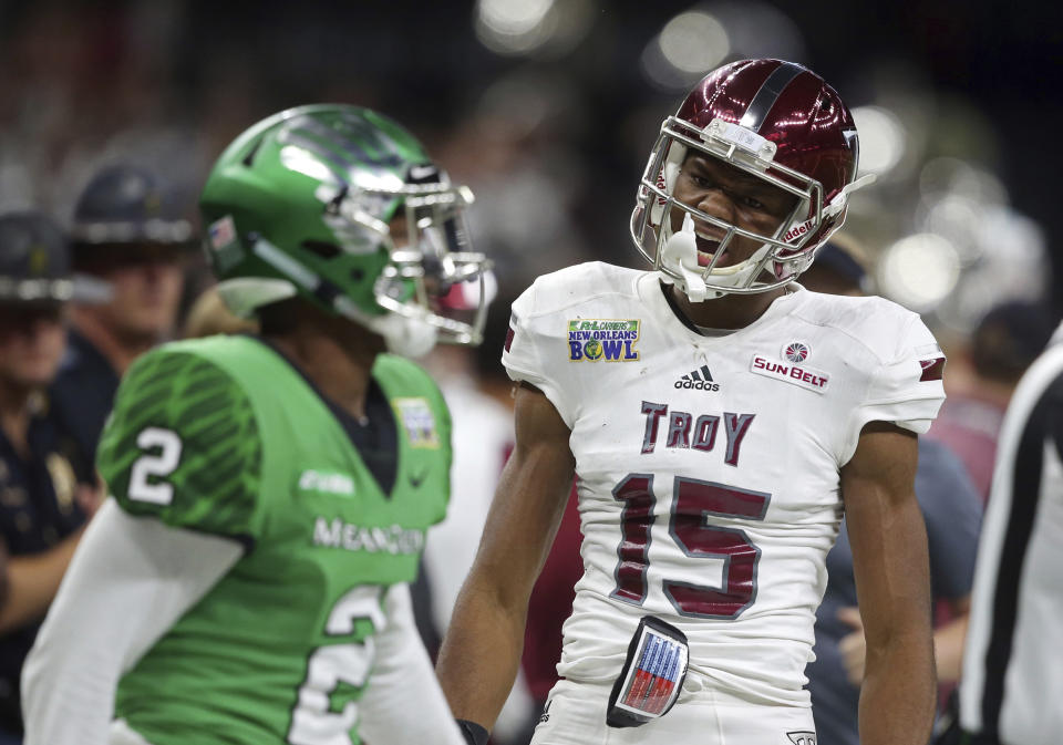 Troy wide receiver Damion Willis (R) celebrates a pass reception over North Texas defensive back Eric Jenkins (2) in the first half of the New Orleans Bowl. (AP Photo/Gerald Herbert)