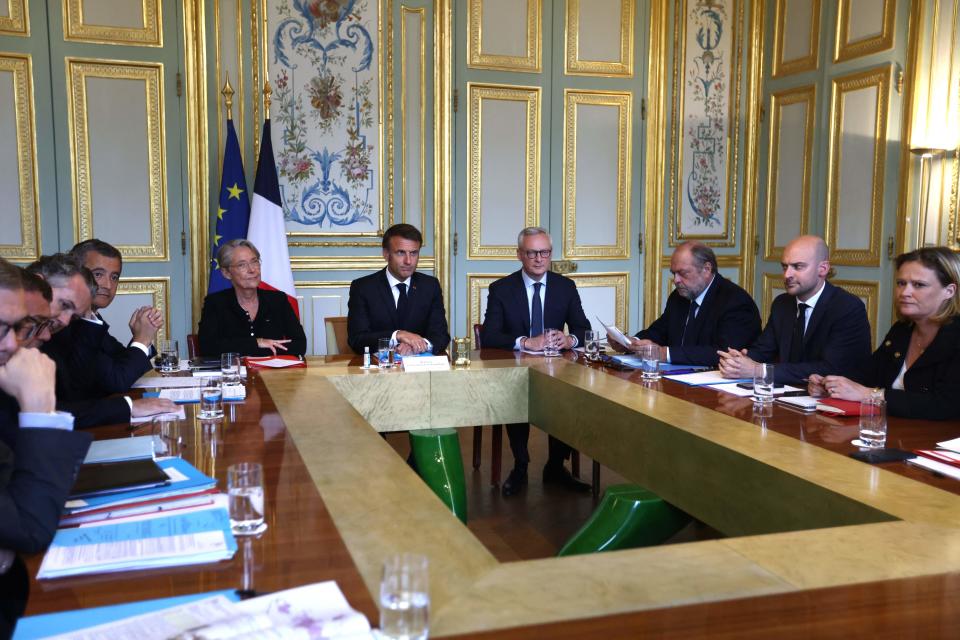 French President Emmanuel Macron attends a government emergency meeting on 2 July 2023 after riots erupted for the fifth night in a row across the country following the death of Nahel, a 17-year-old teenager killed during a traffic stop in Nanterre by a French police officer (AFP via Getty Images)