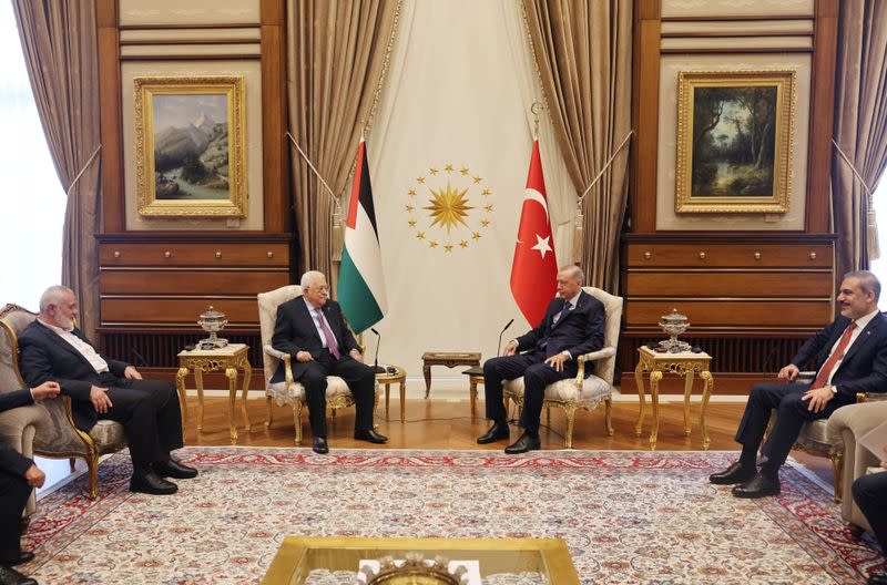 Turkey's President Tayyip Erdogan and Turkish Foreign Minister Hakan Fidan meet with Palestinian President Mahmoud Abbas and Palestinian group Hamas' top leader Ismail Haniyeh at the Presidential Palace in Ankara