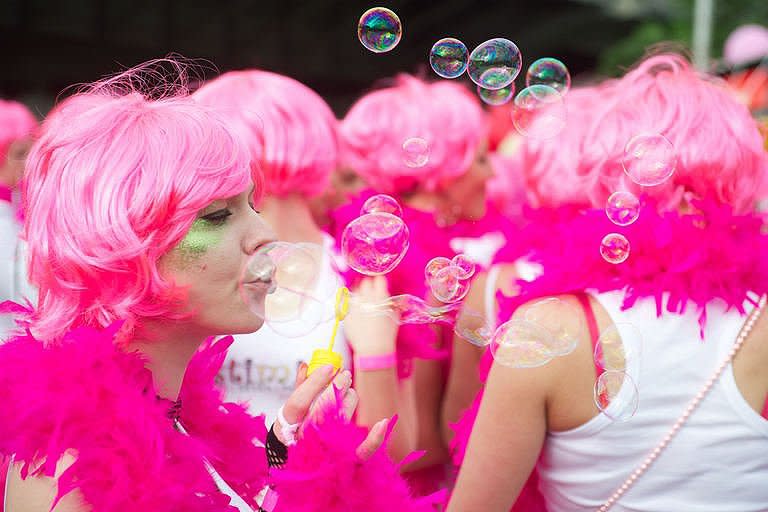 Blonds in pink wigs parade along the river Daugava in Latvia's capital Riga during the "Go Blonde" event. Decked out in pink, hundreds of blondes marched through the streets of the Latvian capital Riga Saturday in a rally started to lift the Baltic state's spirits in a deep slump