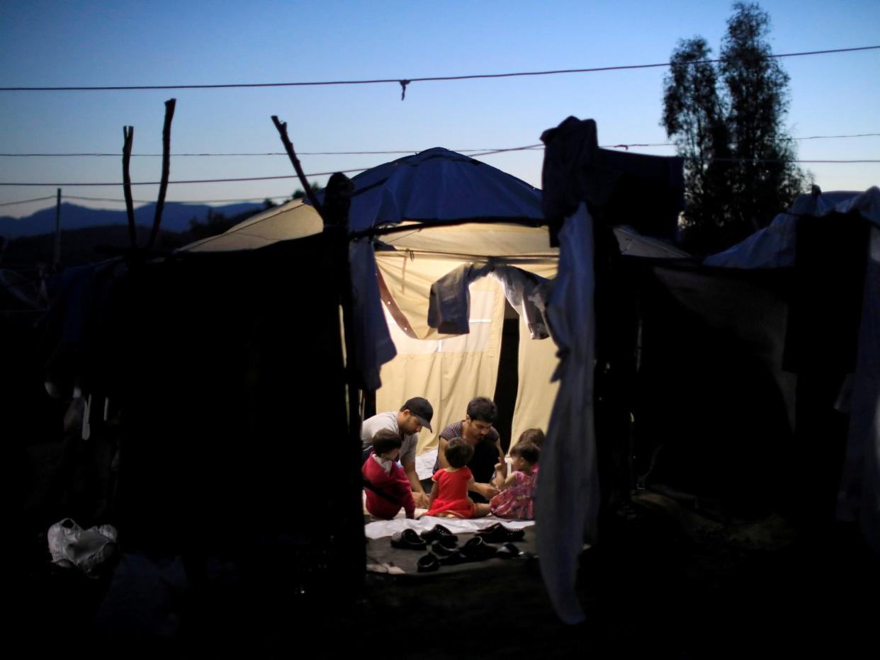 Migrants are pictured in a tent in Greece: REUTERS