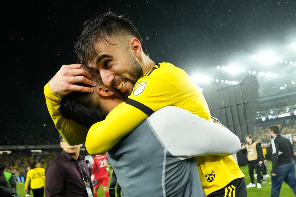 Crew forward Diego Rossi, right, hugs forward Cucho Hernandez following their win over Los Angeles FC in the MLS Cup final.