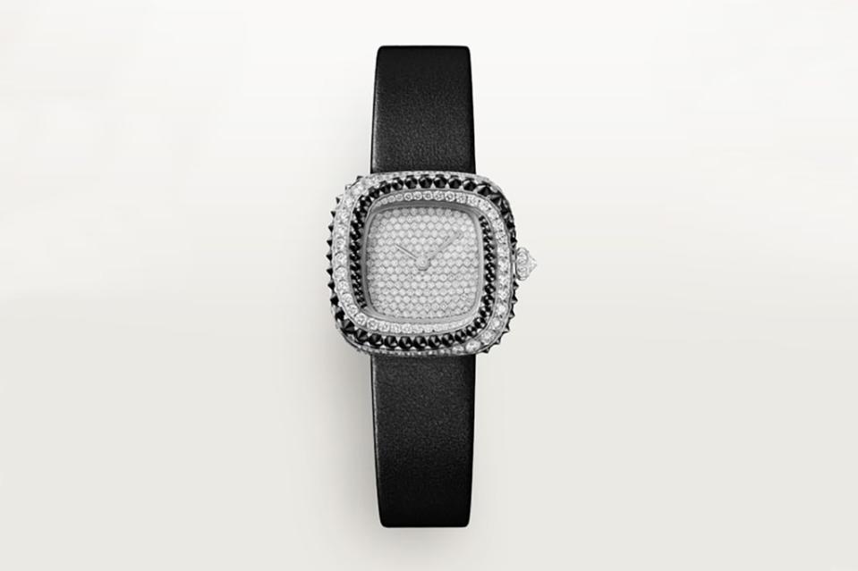 <a href="https://www.londonjewelers.com/brand/cartier.html#/cartier/product/CRWJCS0003/coussin-de-cartier-watch-CRWJCS0003" rel="nofollow noopener" target="_blank" data-ylk="slk:Coussin de Cartier watch in 18-k white gold with diamonds and spinels (similar),;elm:context_link;itc:0;sec:content-canvas" class="link ">Coussin de Cartier watch in 18-k white gold with diamonds and spinels (similar),</a> $56,000, at London Jewelers