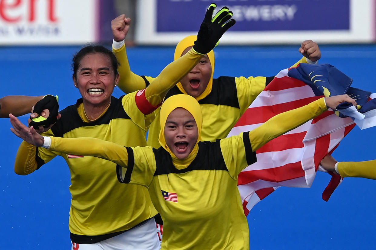 Malaysia's players celebrate winning the women's field hockey final match at SEA Games 2023