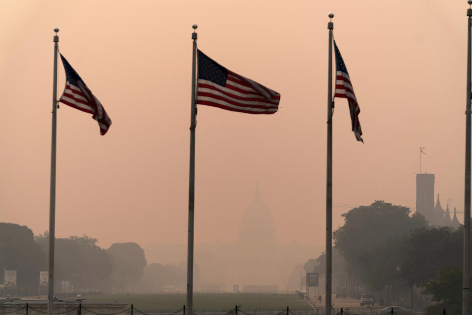 <p>The U.S. Capitol is barely seen at the national mall as a thick layer of smoke covers the nations capital, Thursday, June 8, 2023, in Washington. Intense Canadian wildfires are blanketing the northeastern U.S. in a dystopian haze, turning the air acrid, the sky yellowish gray and prompting warnings for vulnerable populations to stay inside. (AP Photo/Jose Luis Magana)</p> 